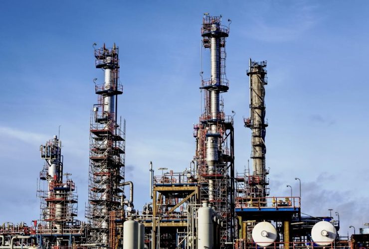 A modern factory in an industrial zone under a blue sky - a cool picture for presentations